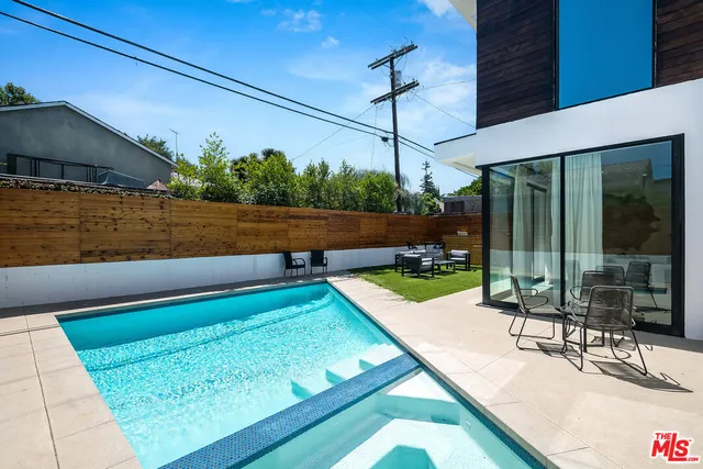 a view of a swimming pool with a patio