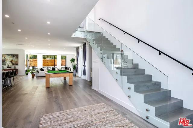 a view of livingroom with dining room and wooden floor