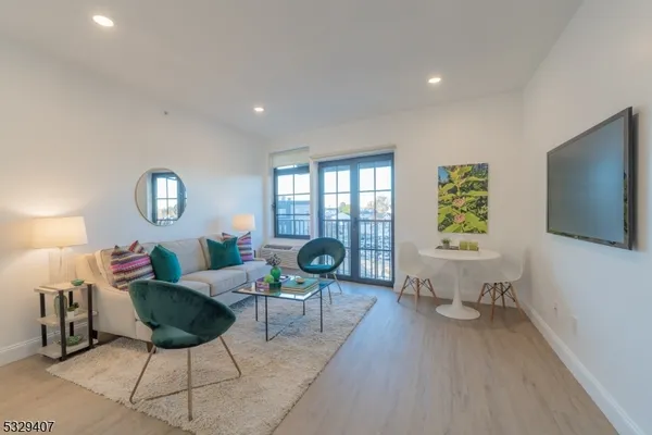 a view of a living room and dining room