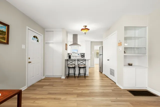 a view of a kitchen from the hallway