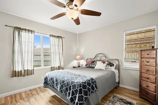 a bedroom with a large bed and a window