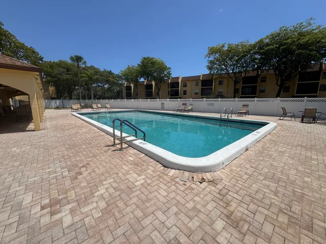 a view of a swimming pool with a patio