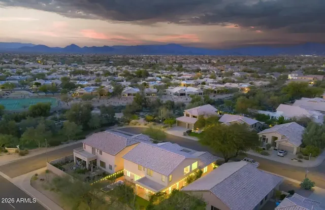 an aerial view of residential houses with outdoor space
