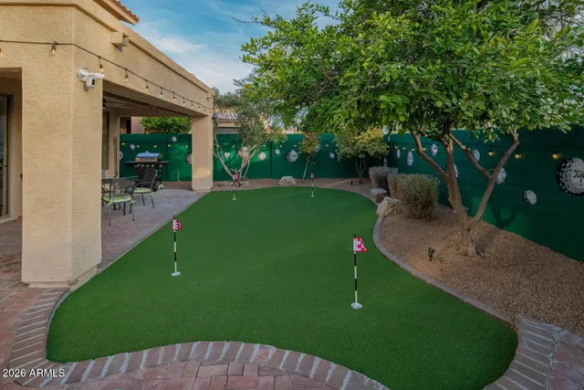 a view of a backyard with sitting area