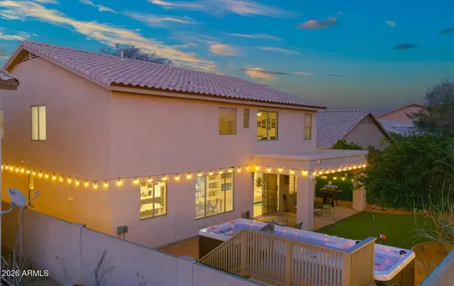 a view of an chairs and table in the backyard