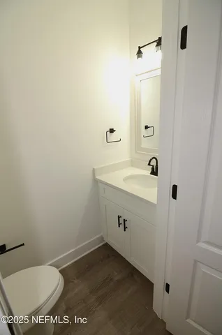 a view of a livingroom with a ceiling fan and window