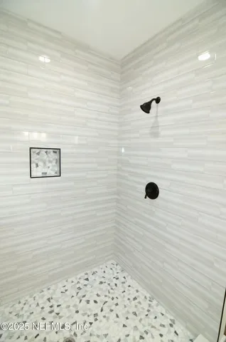 a bathroom with a double vanity sink mirror and a toilet