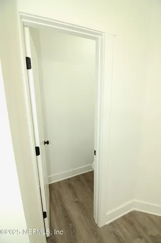 a bathroom with a sink mirror vanity and toilet