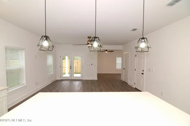 a kitchen with a refrigerator stove and microwave