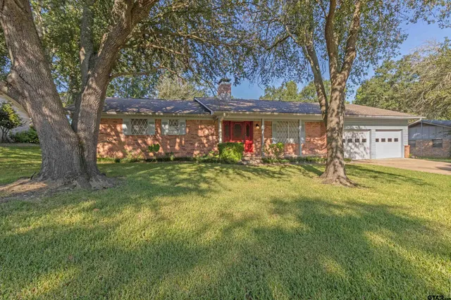 front view of a house with a big yard
