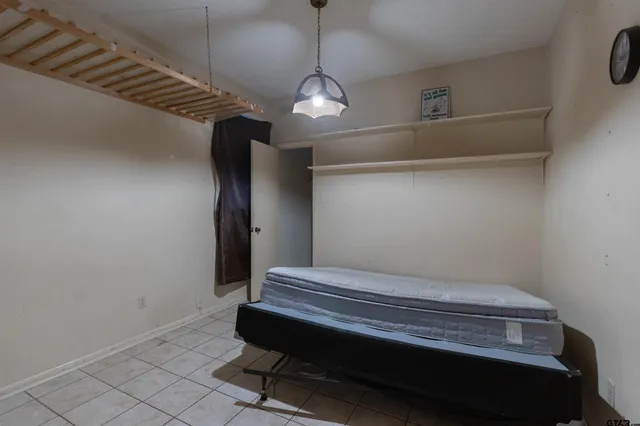 a view of room with stairs and wooden floor