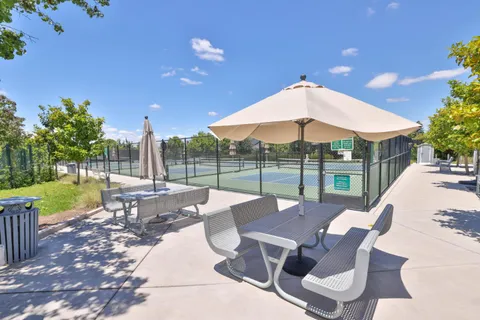 a patio with table and chairs