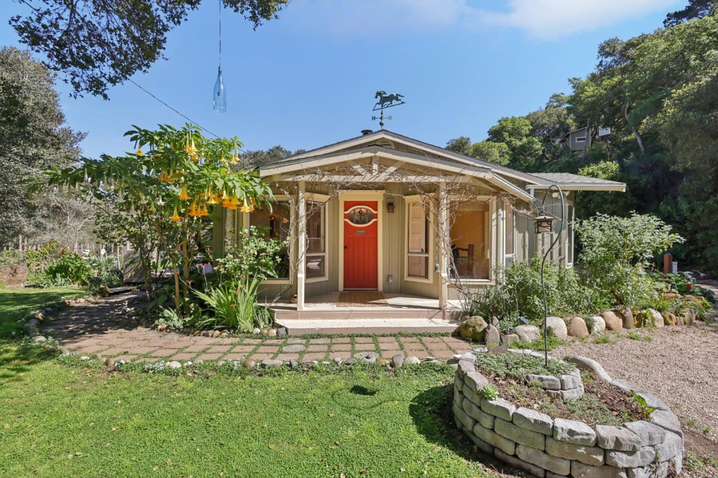 122 Strawberry Road Watsonville, CA 95076 - Photo 2 of 57 a front view of a house with a yard