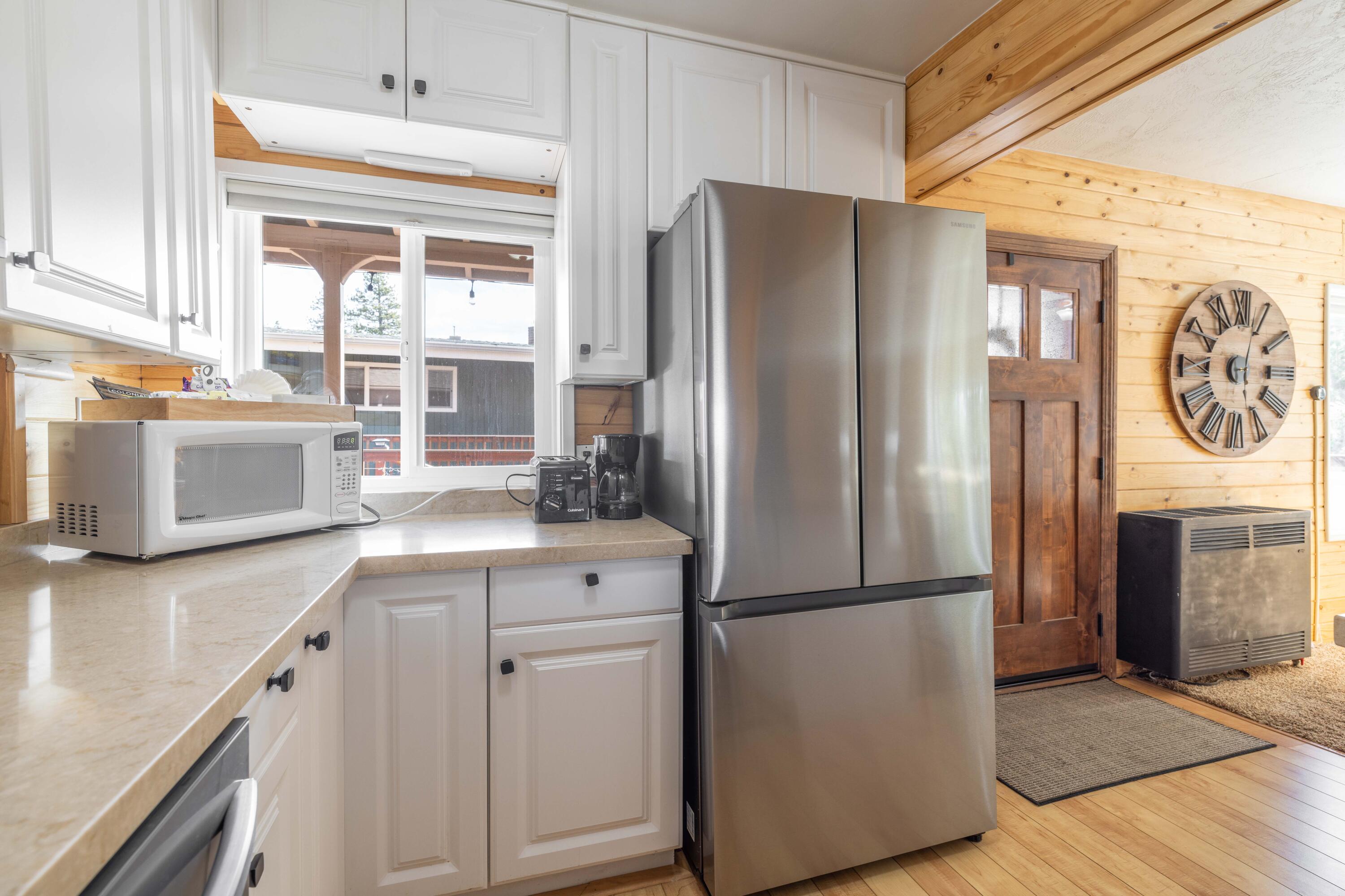 42948 Moonridge Road Big Bear Lake, CA 92315 - Photo 27 of 59 a kitchen with a refrigerator and a sink