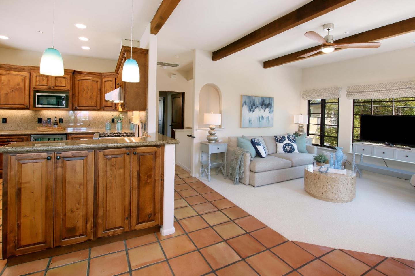 107 Beachgate Way Aptos, CA 95003 - Photo 15 of 95 a living room with furniture a flat screen tv and a view of kitchen