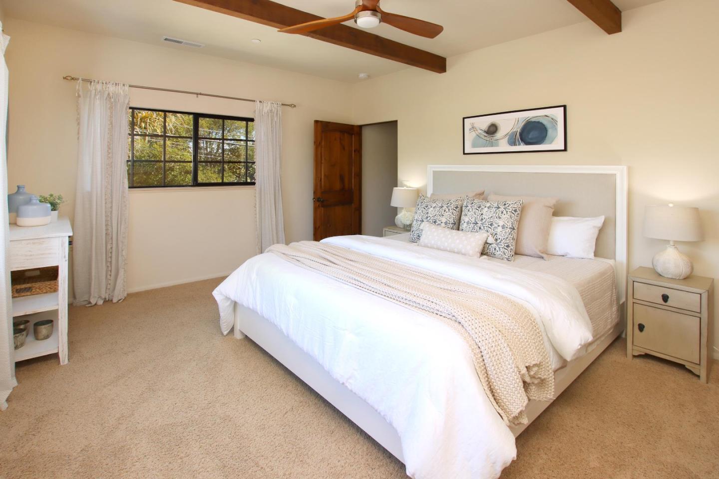 107 Beachgate Way Aptos, CA 95003 - Photo 46 of 95 a bedroom with a bed and a painting on the wall