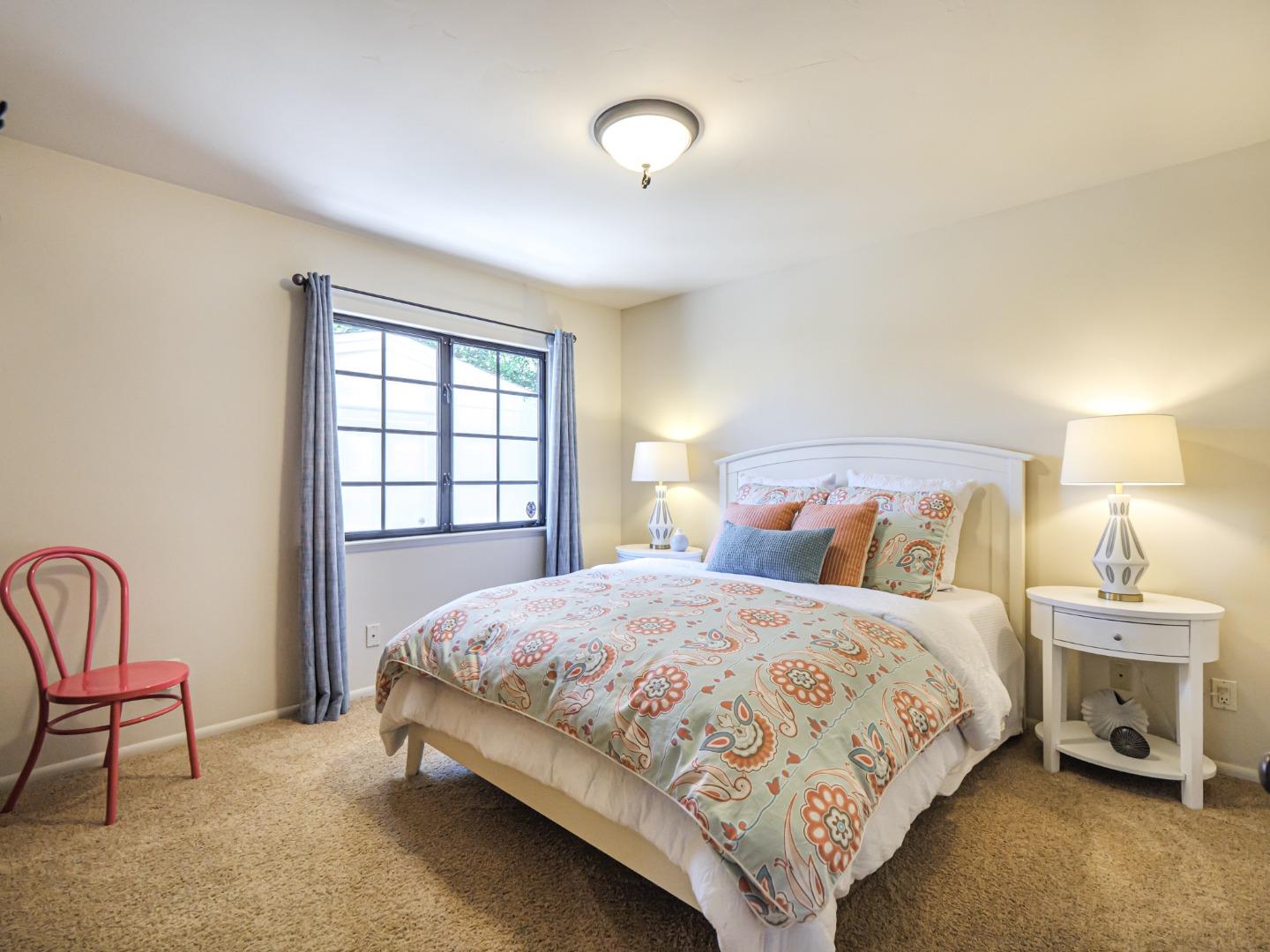 107 Beachgate Way Aptos, CA 95003 - Photo 92 of 95 a bedroom with a bed a chair and a window