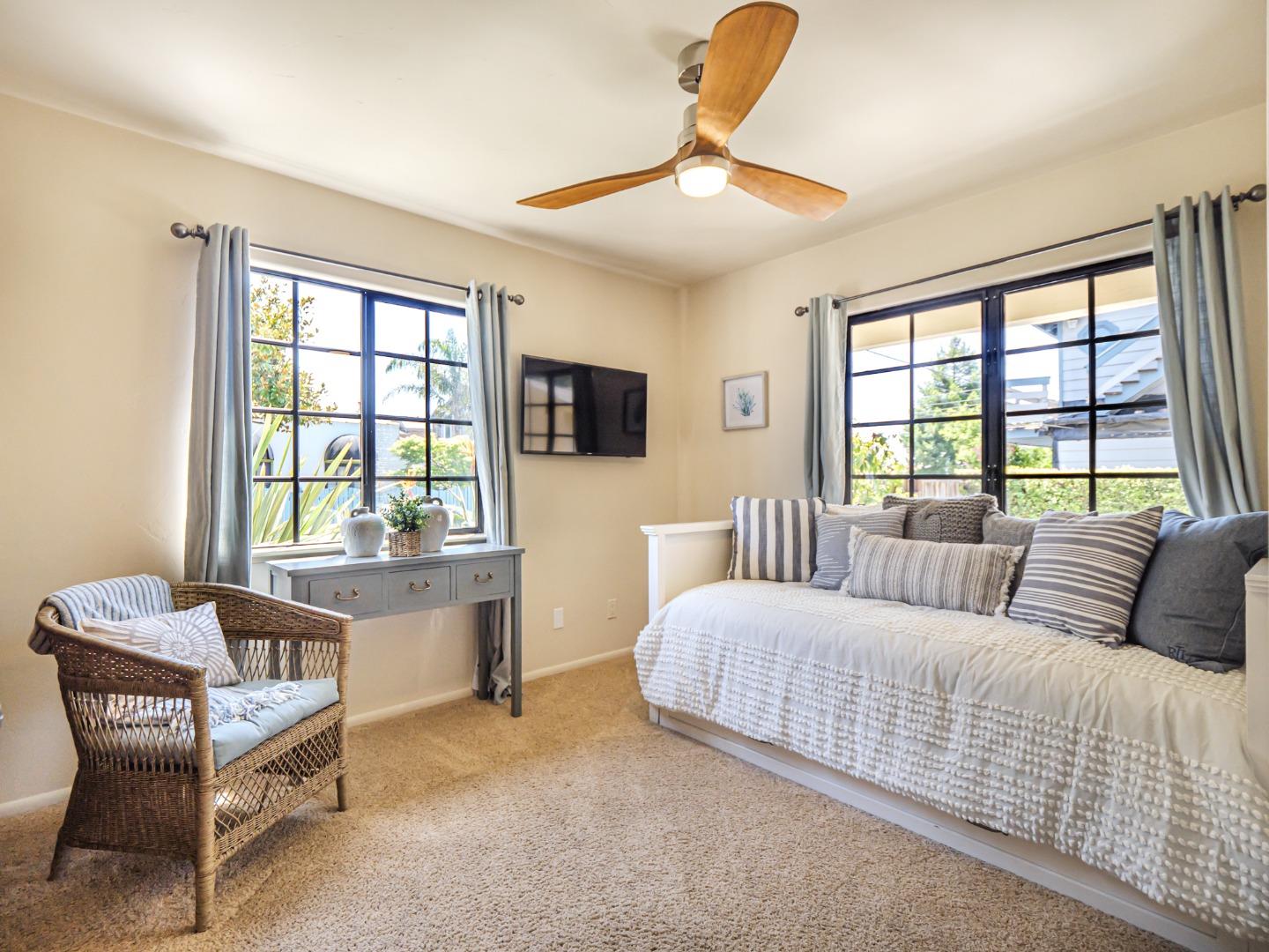 107 Beachgate Way Aptos, CA 95003 - Photo 94 of 95 a bedroom with a bed and a large window