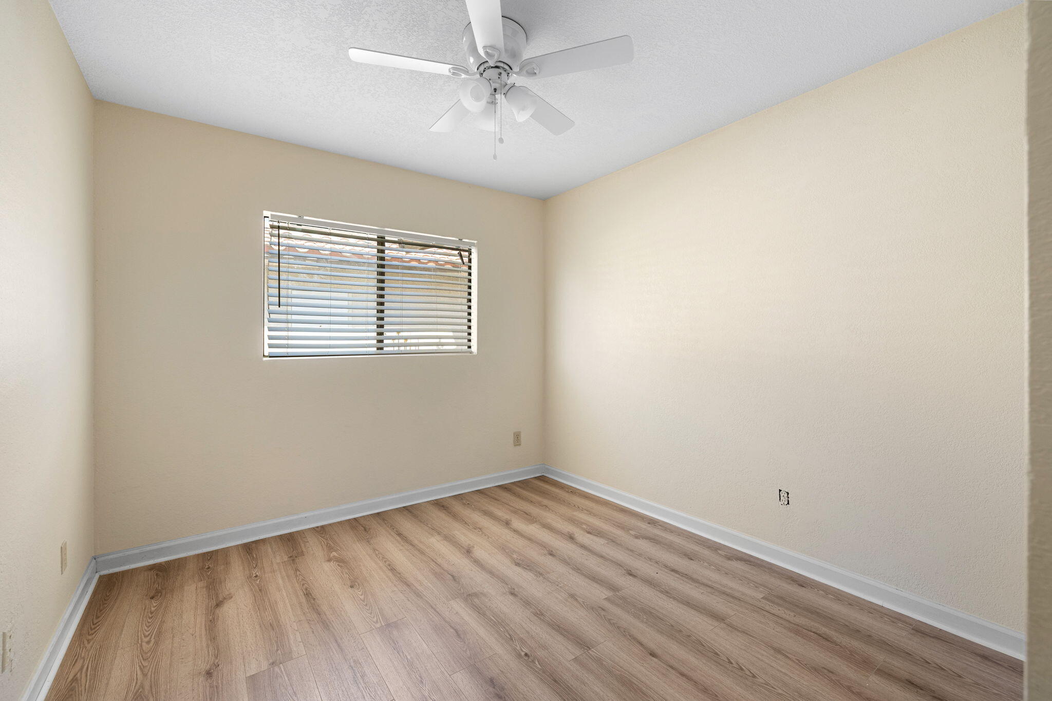 41885 Largo Palm Desert, CA 92211 - Photo 14 of 26 wooden floor in an empty room with a window