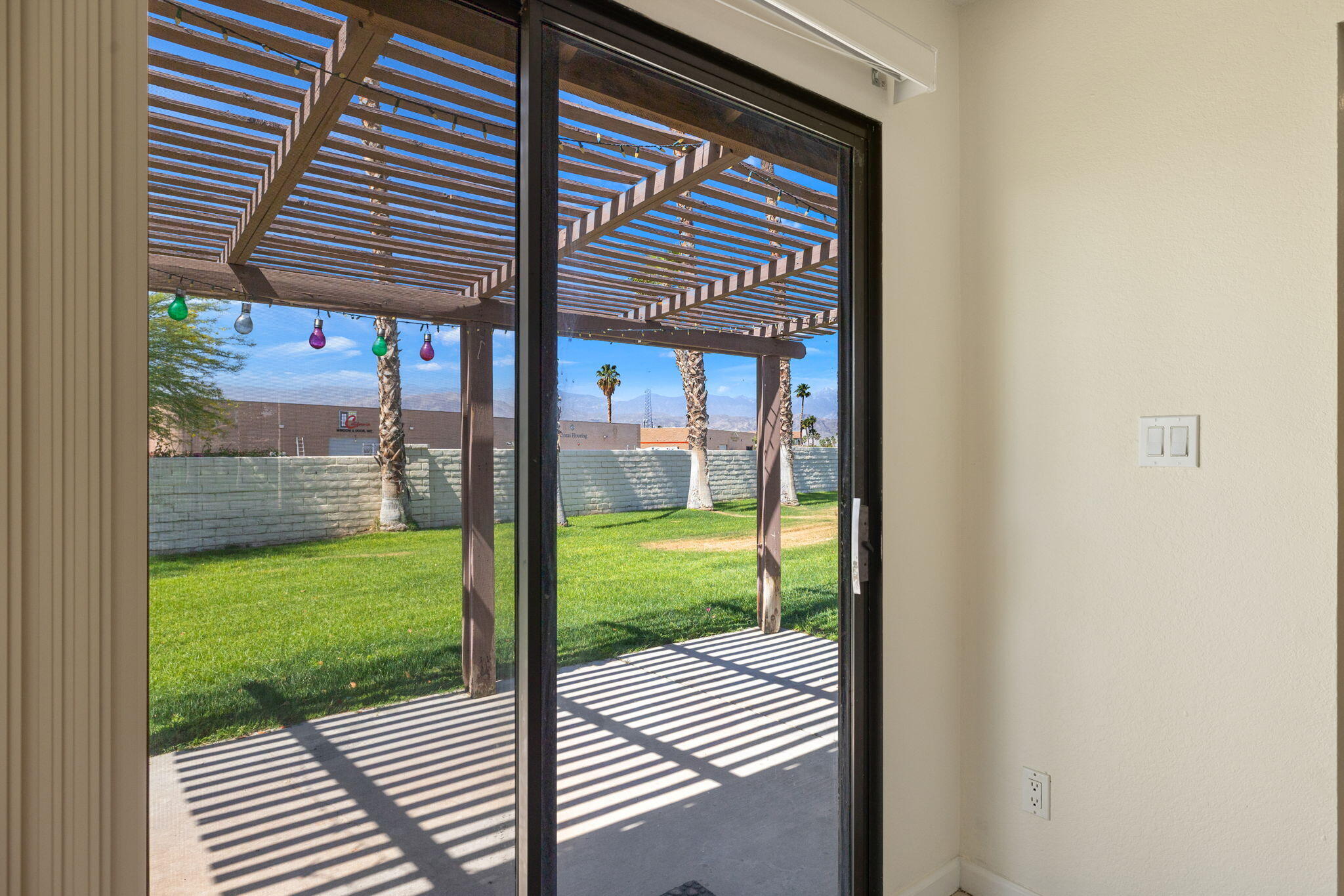 41885 Largo Palm Desert, CA 92211 - Photo 17 of 26 a view of a porch with a floor to ceiling window