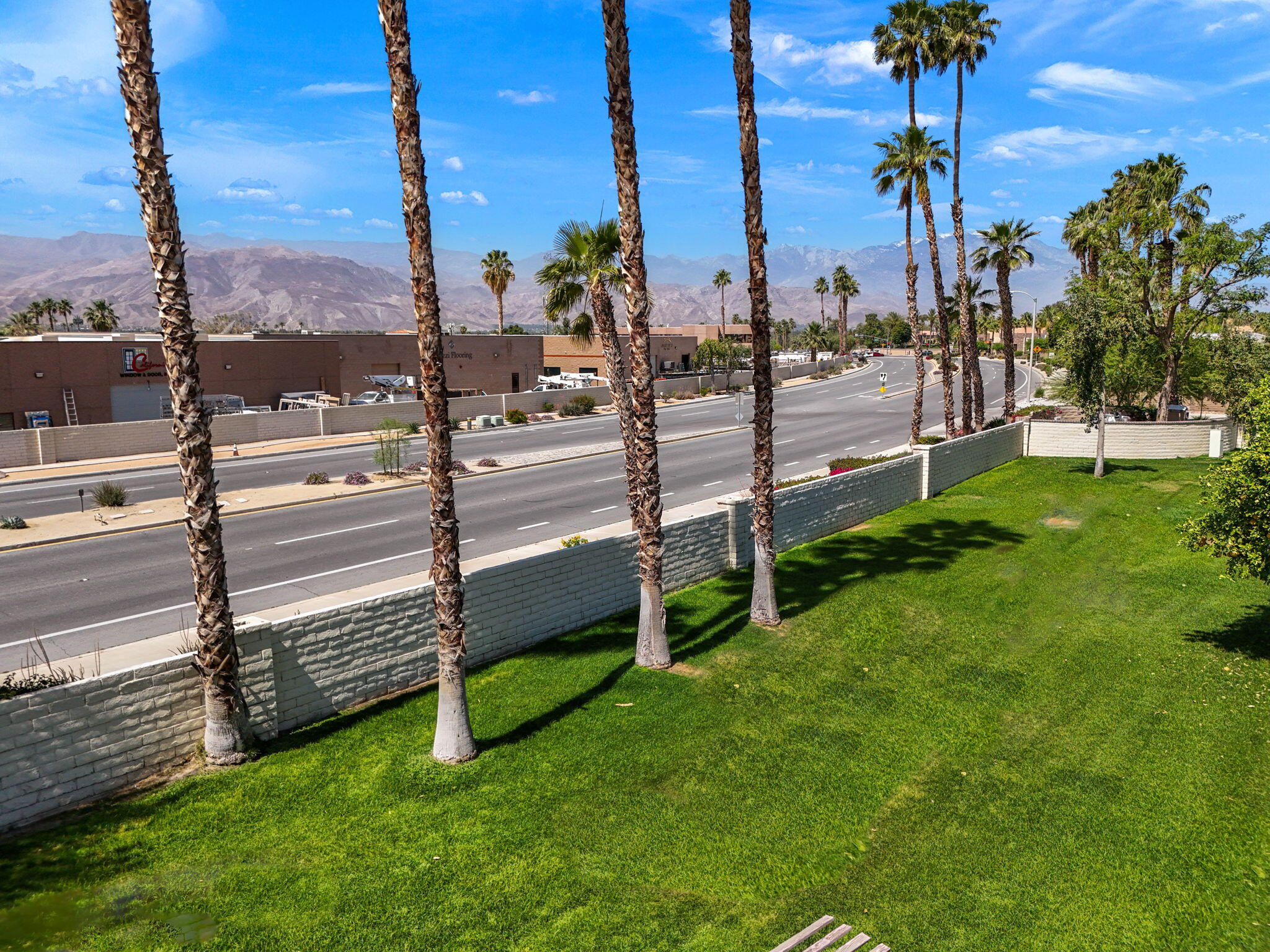 41885 Largo Palm Desert, CA 92211 - Photo 19 of 26 a view of a garden with tall buildings