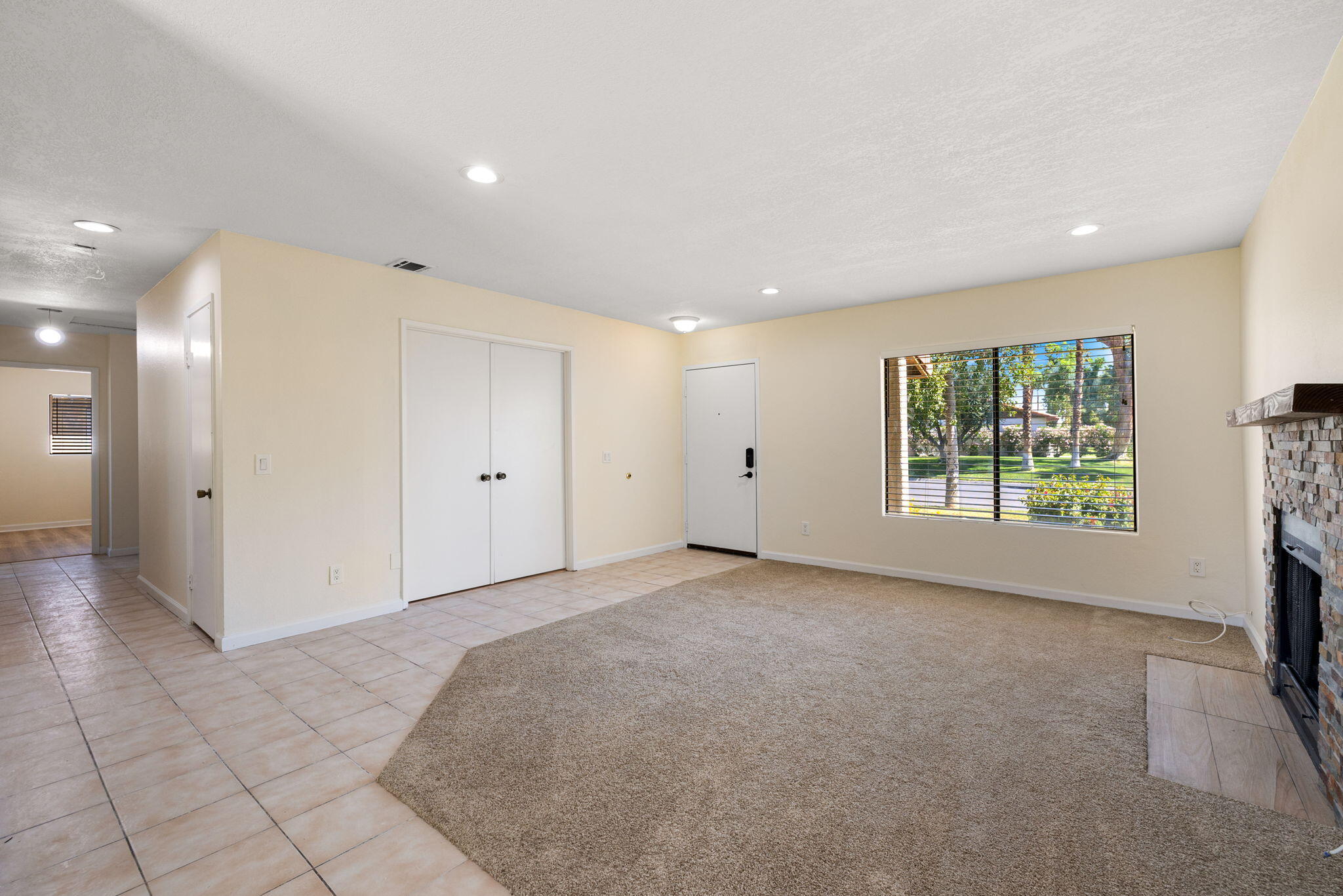 41885 Largo Palm Desert, CA 92211 - Photo 5 of 26 a view of an empty room with a window
