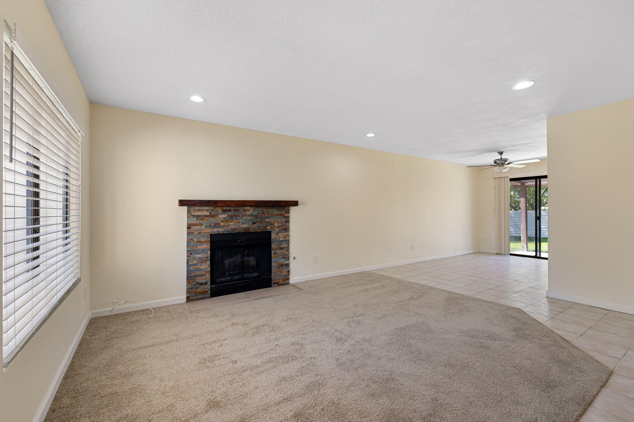 41885 Largo Palm Desert, CA 92211 - Photo 7 of 26 an empty room with windows and fireplace