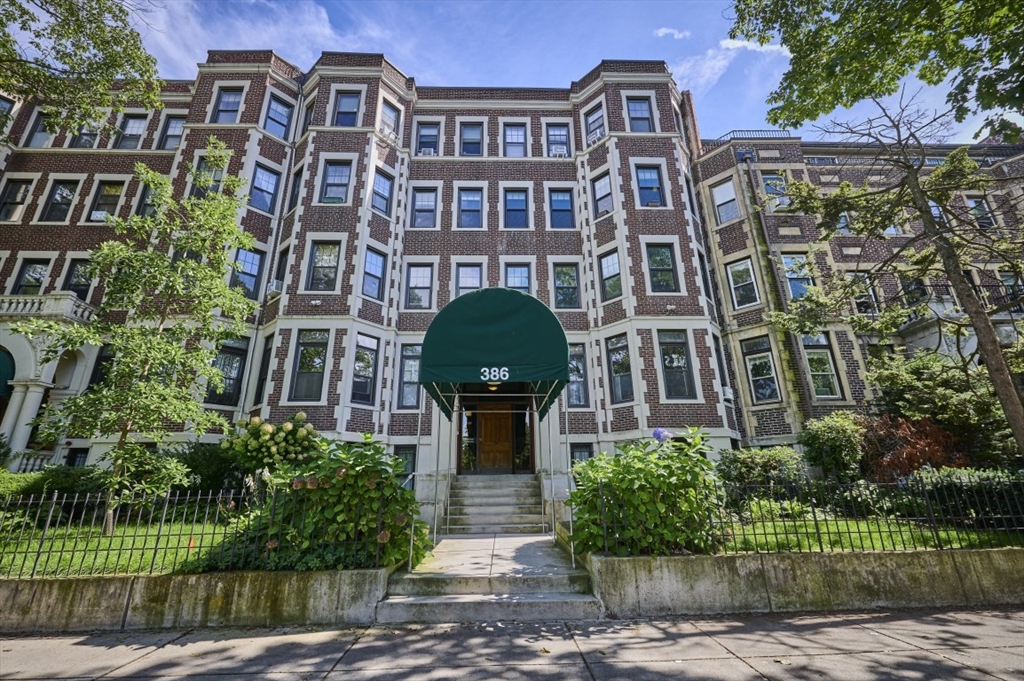 386 Riverway, Unit 4 Boston, MA 02115 - Photo 1 of 14 front view of a brick house with a yard