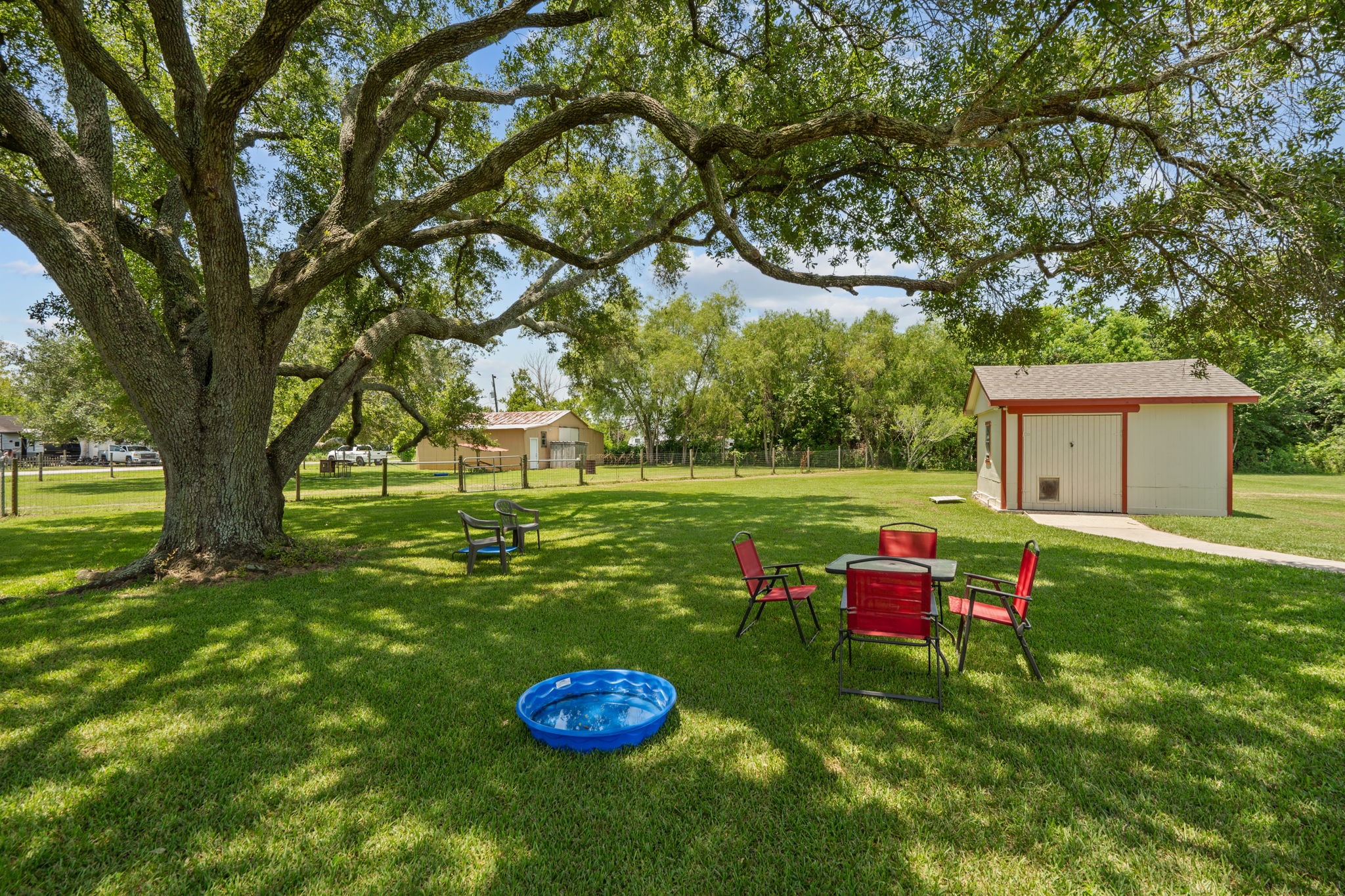 4630 Hudson Road Santa Fe, TX 77517 - Photo 38 of 44 a backyard of a house with table and chairs
