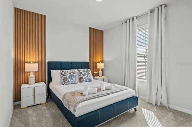 a bedroom with a bed and a couch