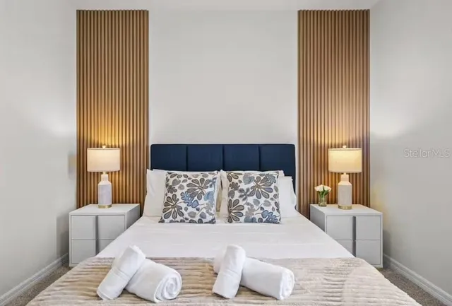 a bedroom with a bed and a couch