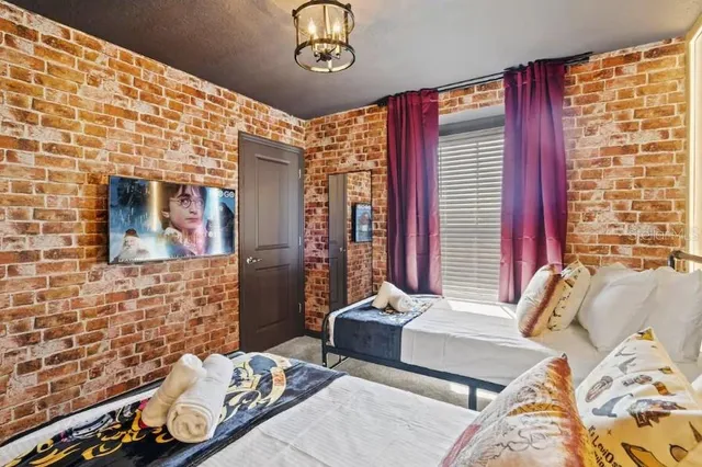 a bedroom with a bed and window