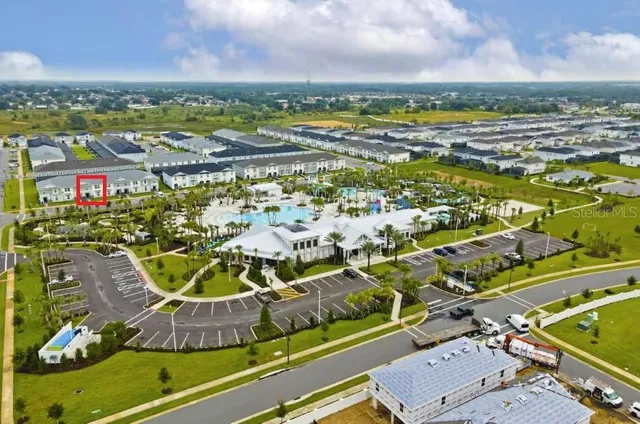 a view of a swimming pool with a table and chairs