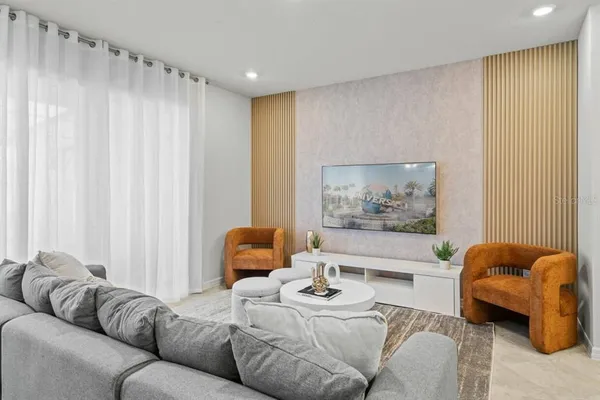 a living room with furniture and a rug