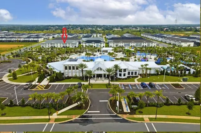 a living room with lots of furniture and white walls