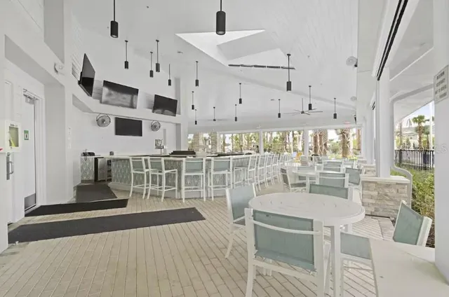 a view of swimming pool with outdoor seating