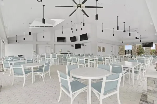 a view of a chairs with chandelier