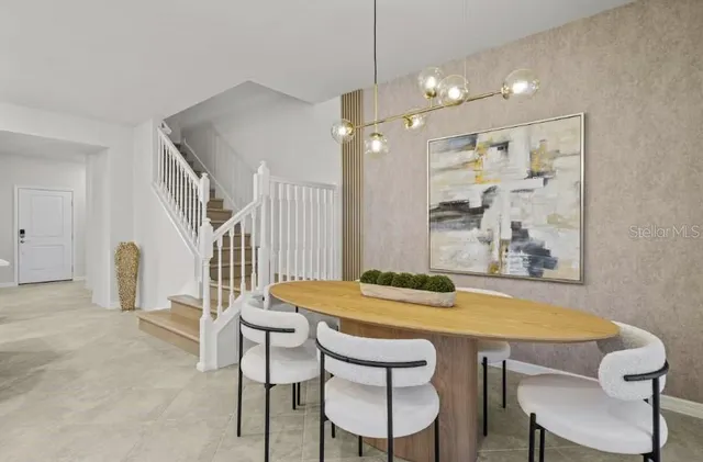 a dining room with furniture and window