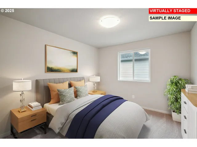 a bedroom with a bed and a painting on the wall