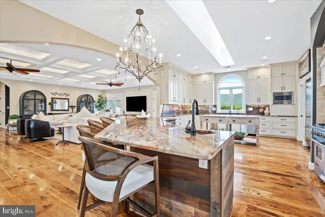 a view of a dining room with furniture large windows and wooden floor