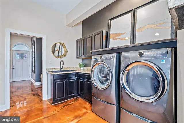 a kitchen with stainless steel appliances a sink and a stove