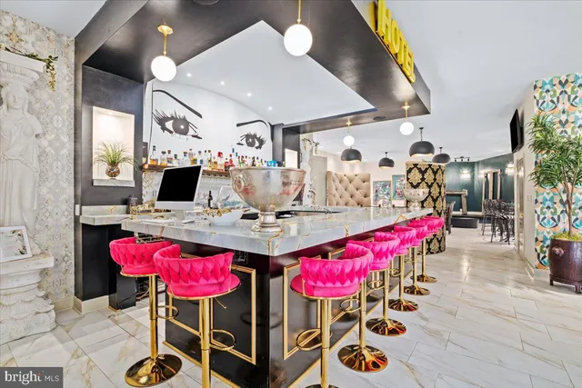 a view of a house with a yard and sitting area