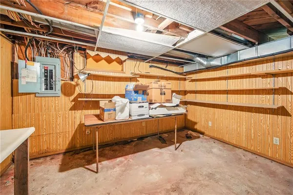 a view of a storage room with a table and chairs