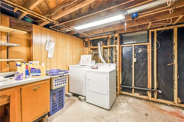 a view of an entryway with wooden floor and a potted plant