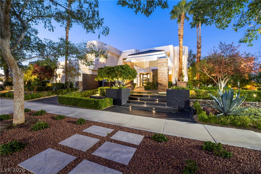 2000 Grouse Street Las Vegas, NV 89134 - Photo 68 of 89 An inviting entrance with stacked stone columns and elegant landscaping defines this residence.