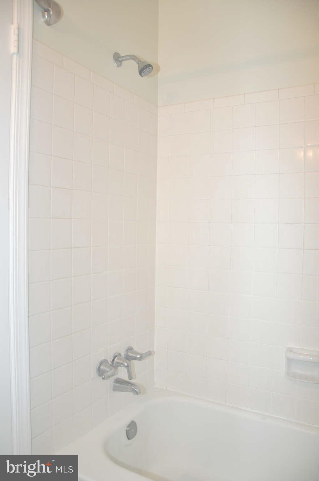 12405 Melmark Court Reston, VA 20191 - Photo 11 of 30 a bathroom with a bathtub