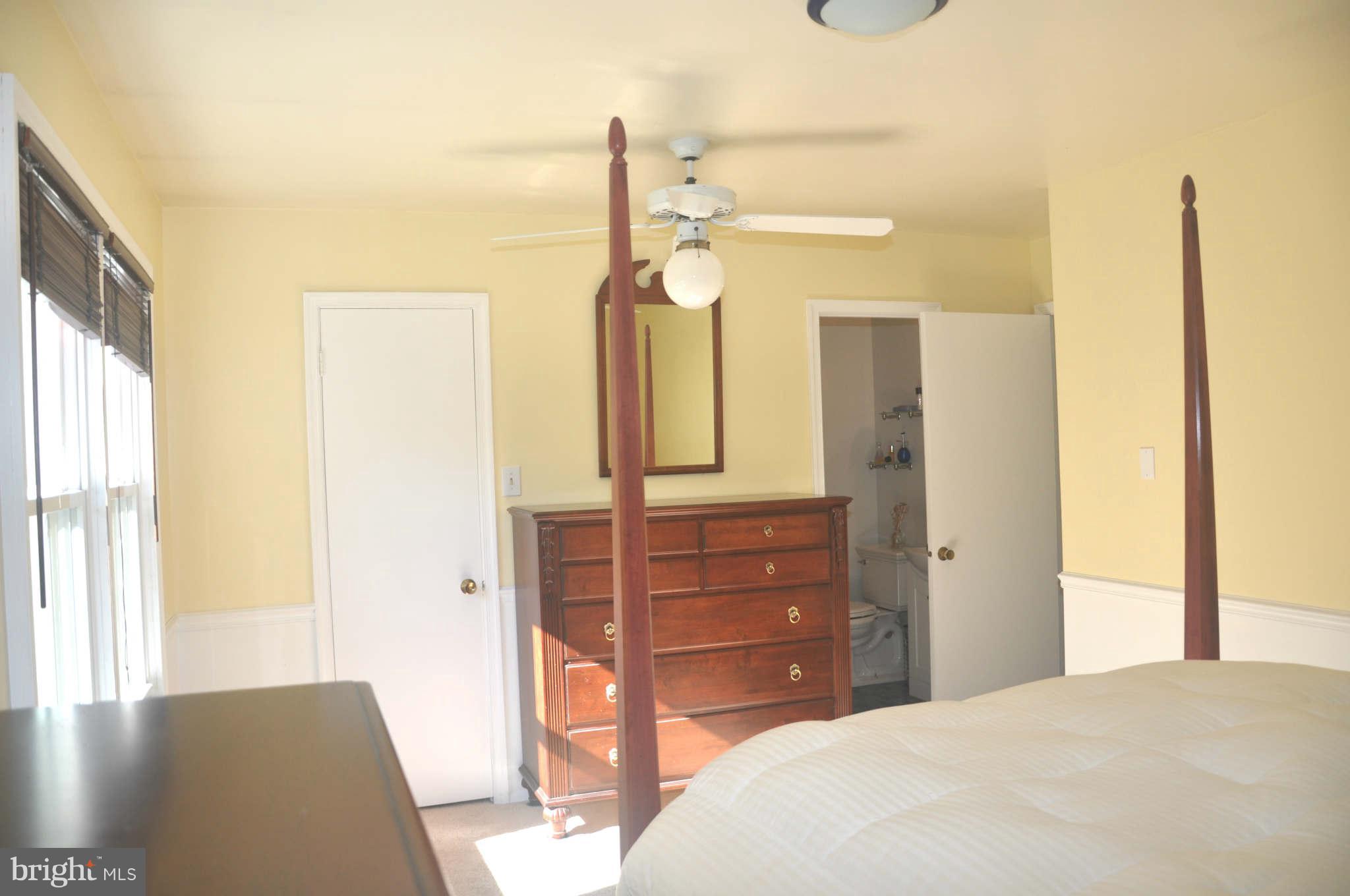 12405 Melmark Court Reston, VA 20191 - Photo 12 of 30 a bedroom with a bed and a dresser