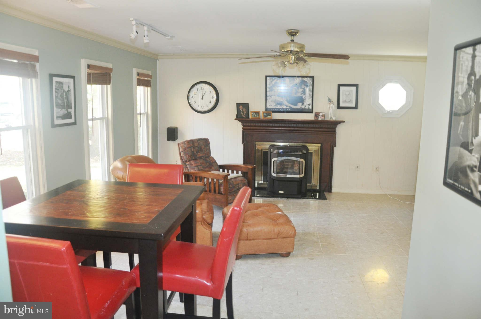 12405 Melmark Court Reston, VA 20191 - Photo 19 of 30 a view of a dining room with furniture and a fireplace