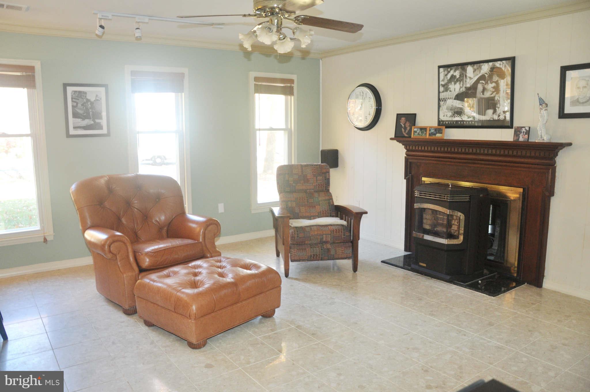 12405 Melmark Court Reston, VA 20191 - Photo 20 of 30 a living room with furniture a window and a fireplace
