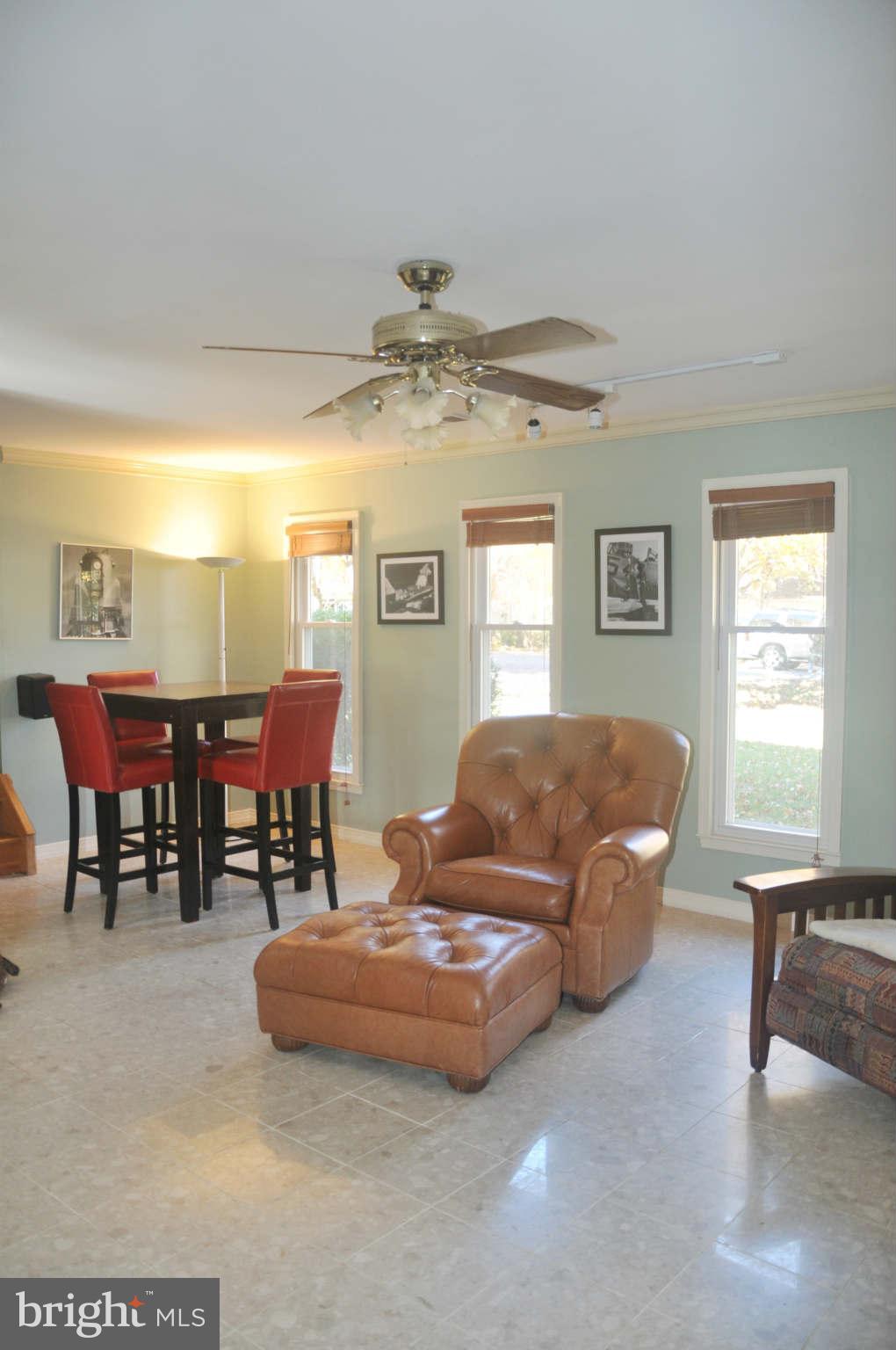 12405 Melmark Court Reston, VA 20191 - Photo 3 of 30 a living room with furniture and a chandelier